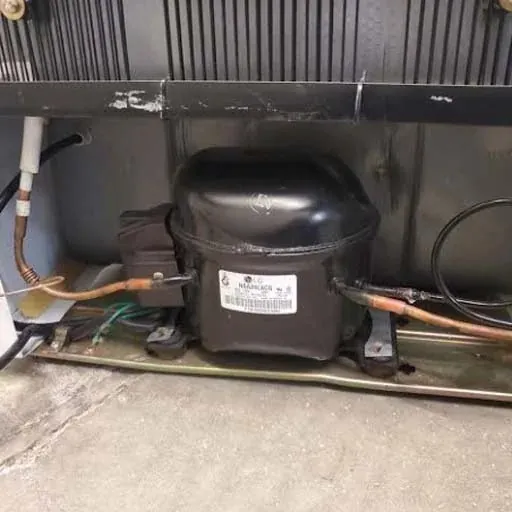 Fridge compressor at the back of a fridge