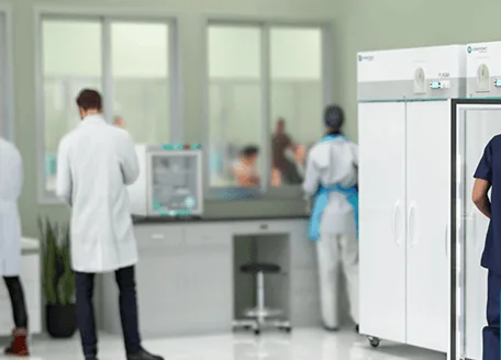 Laboratory with medical fridges and staff at work